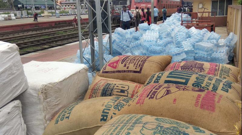 Relief materials piled up at the South Railway station in Kochi (Photo: DC)