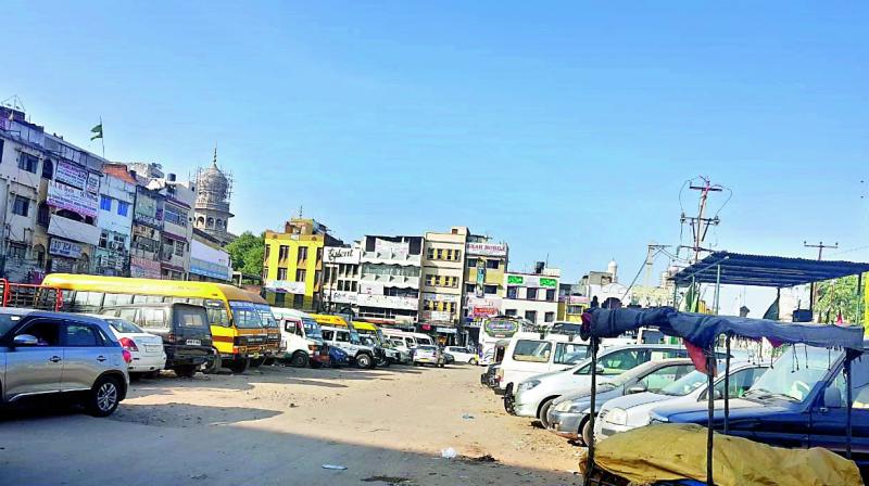Private vehicles are parked in the area that was once the Charminar bus stand. The bus stand was removed after traffic was barred near the monument.