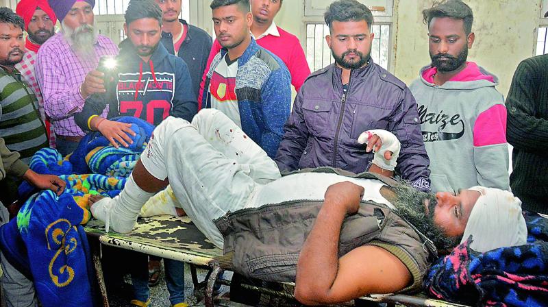 A man injured in a blast at Nirankari Bhawan, a prayer hall in nearby Adliwal village receives treatment at a hospital in Amritsar, on Sunday. 	 (Image: AP)
