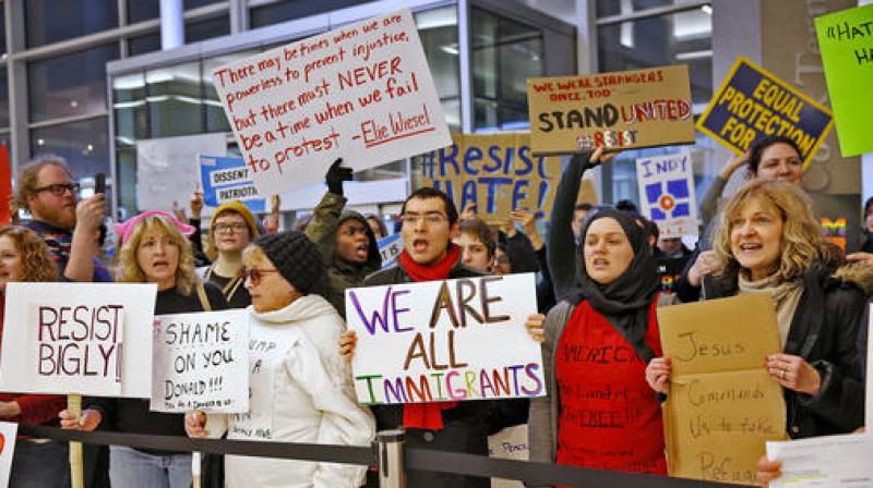 People chant slogans at the Indianapolis International Airport during a protest against President Donald Trumps executive order temporarily suspending all immigration for citizens of seven majority Muslim countries for 90 days. (Photo: AP)