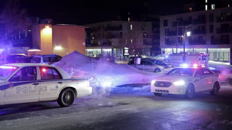 Police survey the scene after deadly shooting at a mosque in Quebec City, Canada. (Photo: AP)