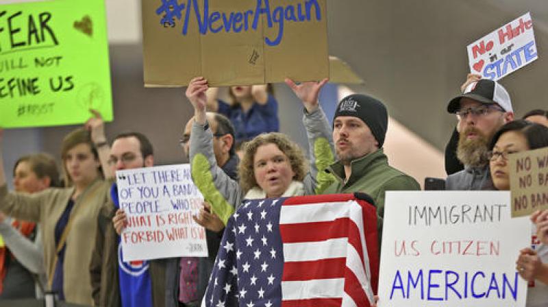 People chant slogans at the Indianapolis International Airport during a protest against President Donald Trumps executive order temporarily suspending all immigration for citizens of seven majority Muslim countries. (Photo: AP)