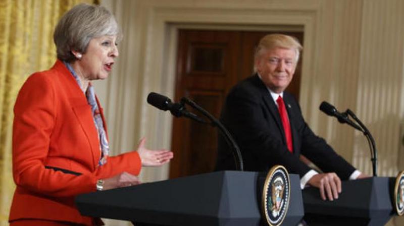 UK PM Theresa May invited Trump at the White House on Friday and announced that he had been invited to come to Britain later this year as the guest of Queen Elizabeth II. (Photo: AP)
