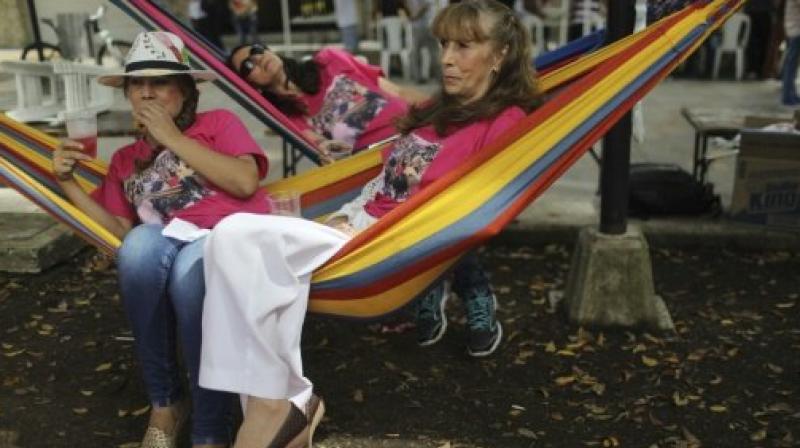 Colombians drag their beds to streets to mark World Laziness Day