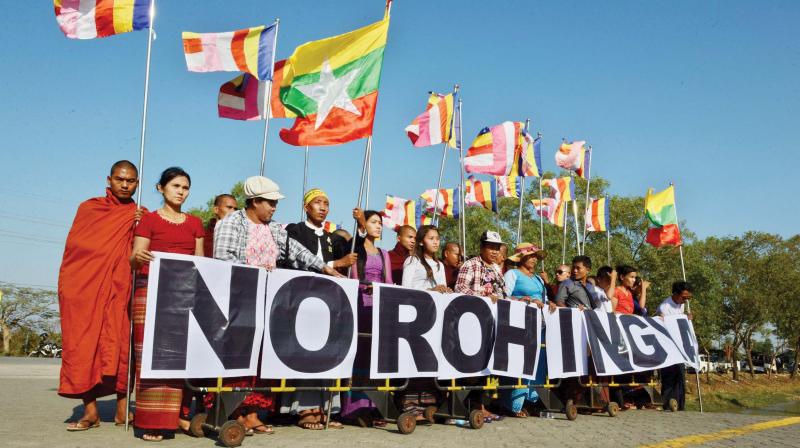 An anti-Rohingya hardline Buddhist group, together with Buddhist monks, rally outside Yangons Thilawa port as the Malaysian ship carrying relief aid for Rohingya Muslim minority arrives. (Photo: AFP)
