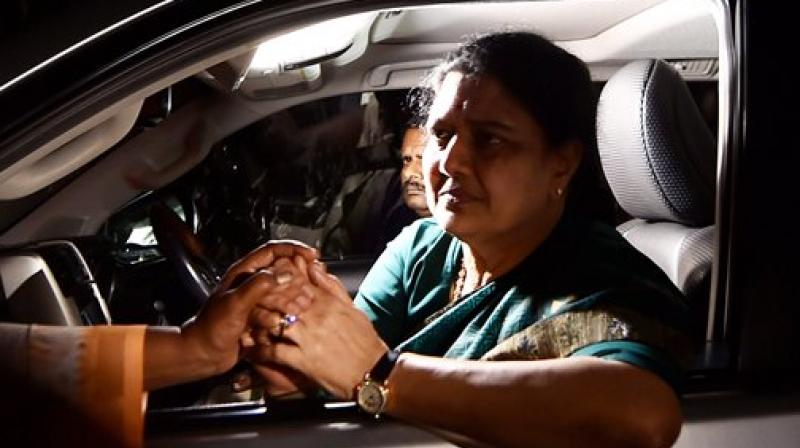 AIADMK General Secretary V K Sasikala consoled by a lady on the way from Koovathur Resort to Poes Garden at Koovathur, outskrits of Chennai on Tuesday. (Photo: PTI)