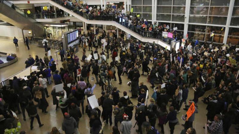 More than 1,000 people gather at Seattle-Tacoma International Airport, to protest President Donald Trumps order that restricts immigration to the U.S. (Photo: AP)
