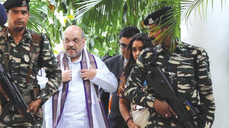 BJP president Amit Shah arrives for a press conference in Bengaluru on Monday. (Photo: R. Samuel)