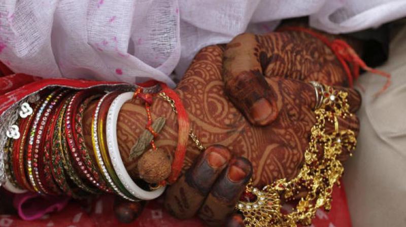 A dowry harassment case was registered against SI Chittibabu, wife Saroja, son Premkumar and daughter Swarnalatha at the Malkajgiri police station in 2015.