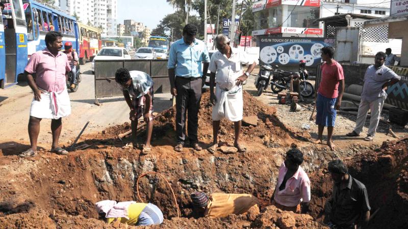 Kerala Water Authority workers carry out pipeline laying works at Thykoodam on Monday. (Photo:  DC)