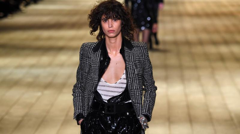 A model presents a creation for Saint Laurent during the 2018/2019 fall/winter collection fashion show on February 27, 2018 in Paris. (Photo: AFP)