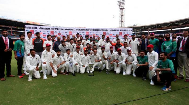 During the post-match presentation, in a rare and heart-touching gesture, stand-in skipper Ajinkya Rahane called the Afghan team for the victory photo opportunity and also handed over the trophy to the debutants to boost their morale. (Photo: Twitter / BCCI)