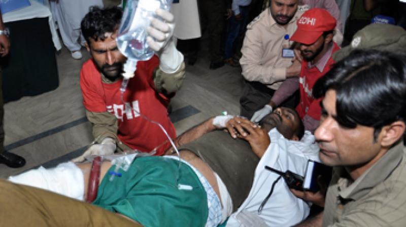 Around 14 were policemen among the 25 who were injured in the blast. The condition of four policemen is stated to be critical, Rescue 1122 spokesman Jam Sajjad said. (Photo: AP)