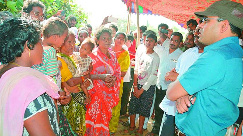 Viziangaram district collector Vivek Yadav speaks to the relatives of those who drowned at Tatipudi reservoir in the district on Saturday. (Photo: DC)