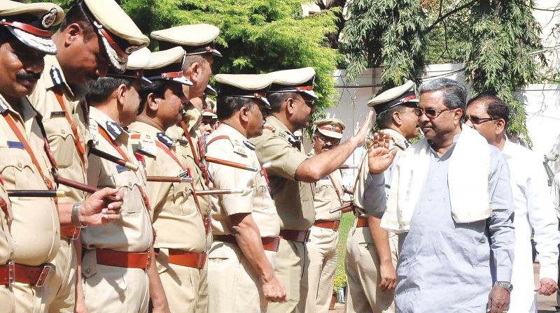 CM Siddaramaiah with senior police officers at the annual conference held in Bengaluru on Monday. (Photo: KPN)