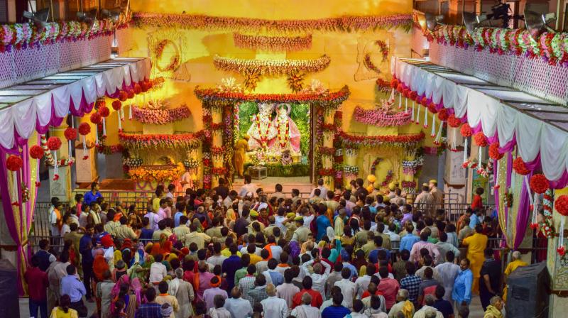 Hindu devotees offer prayers on the occasion of Janmashtami festival celebrations, at Krishna Janmabhoomi Temple in Mathura. (Photo: PTI)