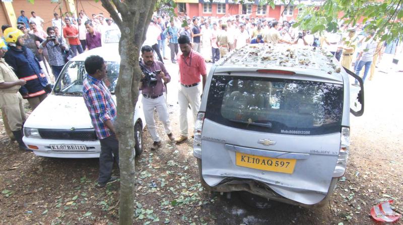 People throng the spot where the blast occured.