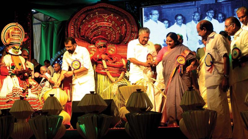 Sangeetha Nataka Akademi chairperson KPAC Lalitha extends a lamp to Chief Minister Pinarayi Vijayan  during the inauguration of the 60th anniversary of Kerala at the Assembly complex on Tuesday. (Photo: DC)