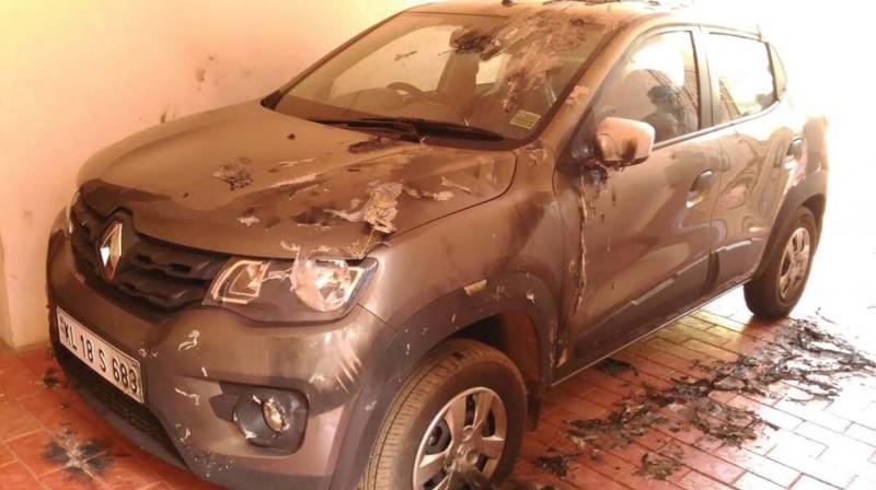 Chombala rural SI Prajeesh Nandanams car that was damaged by miscreants. 	DC