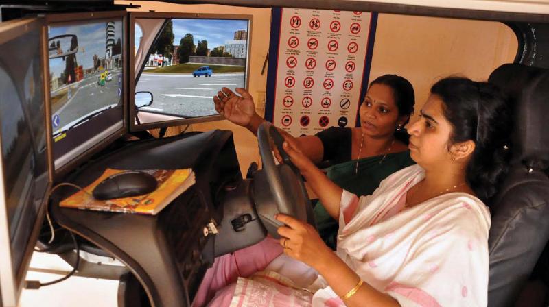An instructor giving directions to a student at a driving school in Kozhikode. 	(Photo: DC)