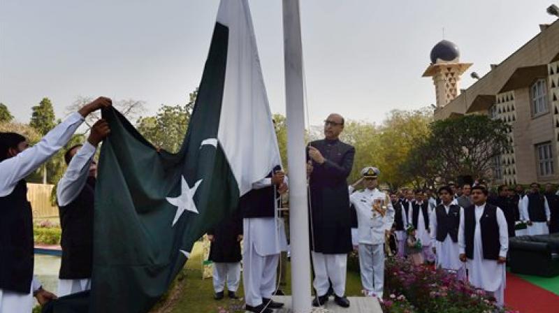 Pakistan High Commissioner Abdul Basit hoists the countrys flag during the Pakistan Day celebrations at Pakistan High Commission in New Delhi. (Photo: AP)