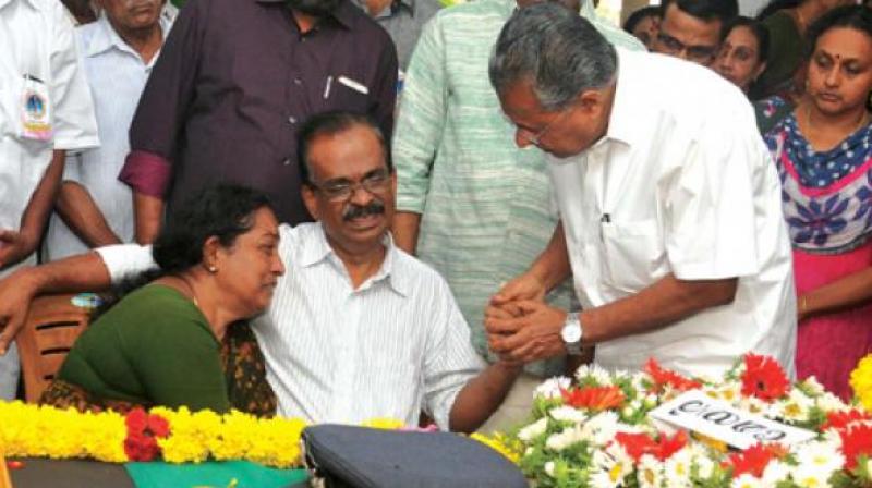 Chief Minister Pinarayi Vijayan consoles V.P. Sahadevan and Jayashree, parents of Flight Lieutenant S. Achu Dev who was killed in Sukhoi-30 crash in Assam, after he paid his respects at their home at Pongumoodu in Thiruvananthapuram on Friday. (Photo: A.V. MUZAFAR)