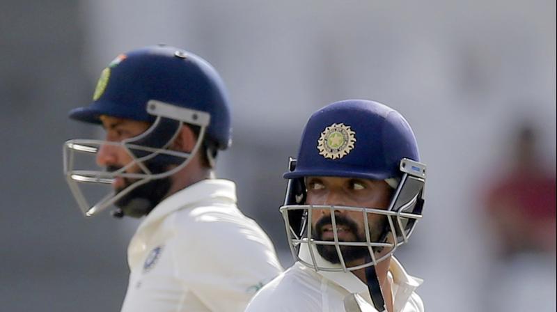 The in-form Pujara registered his 13th Test century in his landmark 50th game as Ajinkya Rahane fired his ninth Test hundred.(Photo: AP)
