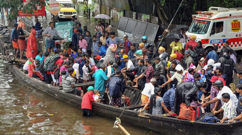 Rescue operations being carried out at flood-affected regions in Kochi on Saturday. (Photo: PTI)