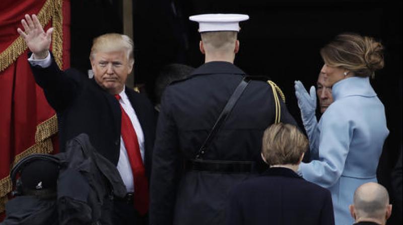 President Donald Trump waves with his wife Melania Trump after being sworn in as the 45th president of the United States during the 58th Presidential Inauguration at the U.S. Capitol in Washington. (Photo: AP)