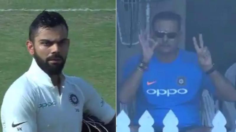 While batting on 97, Kohli pointed out to the dressing room signalling for new gloves and asking if India should declare, to which Shastri responded with a different gesture. (Photo: BCCI/Screengrab)