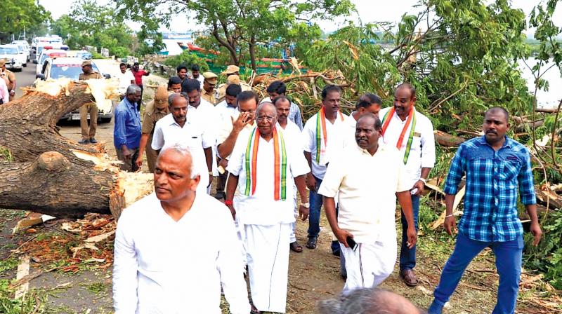 Chief Minister V. Narayansamy inspect the cyclone affected area in Puducherry on Friday. (Photo:DC)