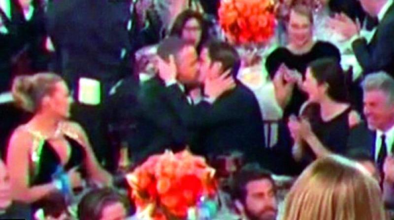 The kiss between Andrew Garfield (right) and Ryan Reynolds  (Far right).