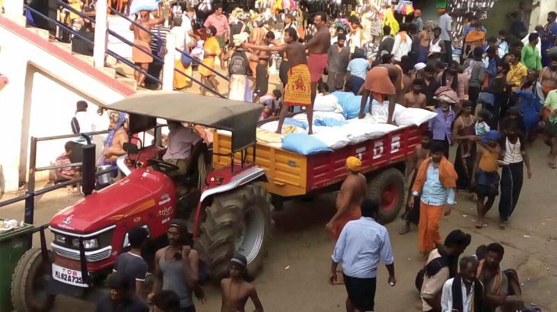 A tractor unloads goods at Sannidhanam. (Photo: DC)