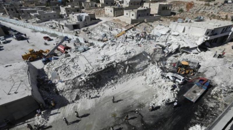 Destroyed buildings are seen on August 12, 2018 following an explosion that reportedly killed 12 people at an arms depot in a residential area in the Syrian town of Sarmada, Idlib province. (Photo: AFP)