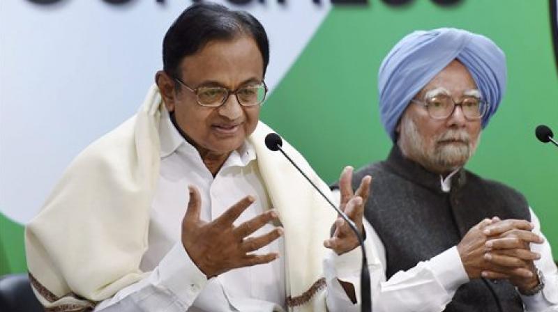 Former Finance Minister P Chidambaram speaks to media after release The REAL State of Economy Report- 2017 at AICC in New Delhi on Monday.Former Prime Minister Manmohan Singh is also seen. (Photo: AP)