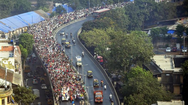 A large number of farmers and tribals take part in a protest march to push for the their long pending demands including better price for their produce, total waiver of agricultural loans and transfer of forest rights to tribals, in Mumbai. (Photo: PTI)