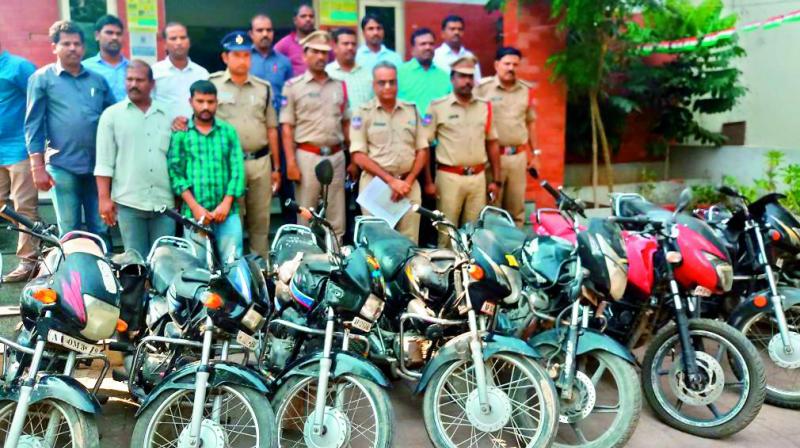 Veerabadrappa (in green shirt) with the police. 	 DC