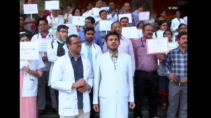 Following an allegation of a doctor being physically assaulted by patients relatives, junior doctors of Gandhi Hospital here continued their protest on Thursday over the safety and security of the doctors. (Photo: ANI)