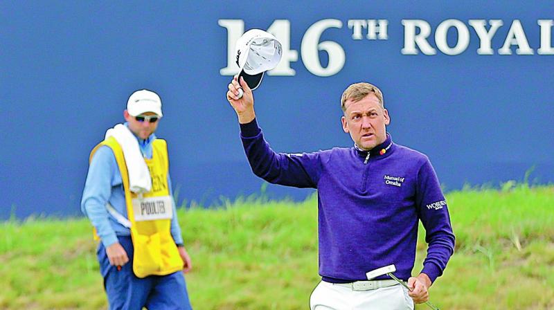 Englands Ian Poulter celebrates after finishing his round on the first day of the British Open at Royal Birkdale in Southport, England, on Thursday. (Photo: AP)