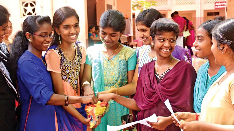 Students congratulating each other on their marks, in Madurai, on Wednesday.(Photo: K. Manikandan)