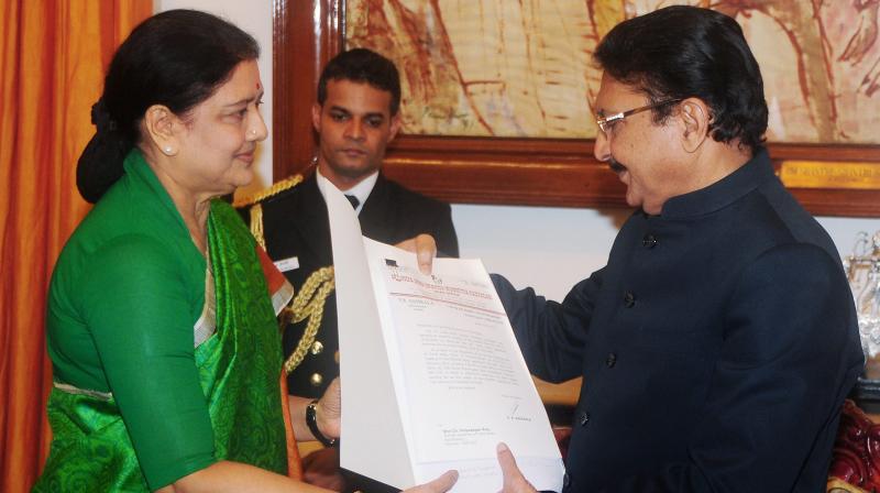 AIADMK General Secretary VK Sasikala presenting the letter of presumably the MLAs support to her candidate to stake claim during the meeting with Tamil Nadu Governor CH Vidyasagar Rao at Raj Bhavan in Chennai. (Photo: PTI)