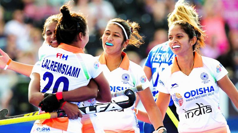 Members of the Indian team celebrate their 3-0 win over Italy in their Hockey Womens World Cup match in London on Wednesday.