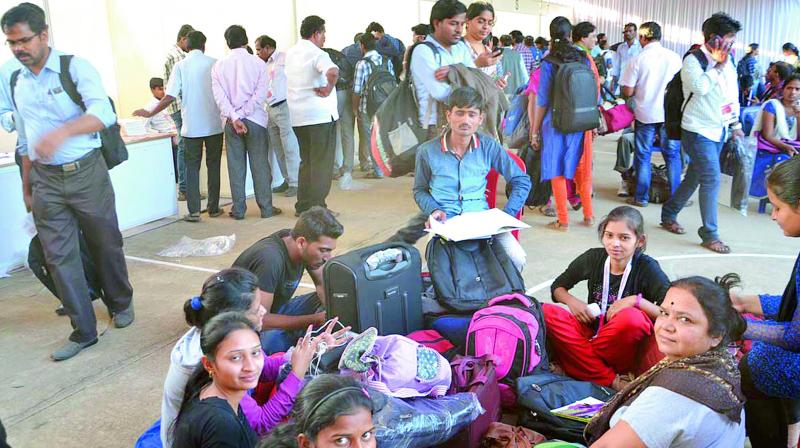 Delegates of the 104th Indian Science Congress await at registration desk to collect their accommodation details at Sri Venkateshwara University Campus in Tirupati on Monday. (Photo: DC)