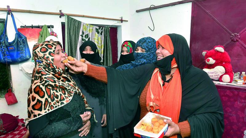 Muslim women celebrating the introduction of Triple Talaq Bill in the Lok Sabha, in Lucknow on Thursday. (Photo: PTI)