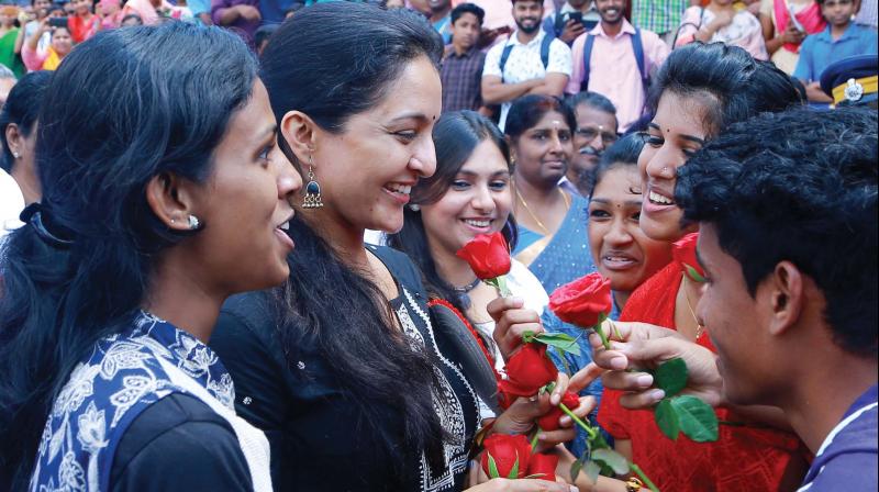 Actor Manju Warrier receives flowers from students as she reaches for the inauguration of Sarga Sangamam 2017, the CBSE Sahodaya School Festival at Mangalam Public School near Ettumanoor in Kottayam on Tuesday. 	(Photo: Rajeev Prasad)