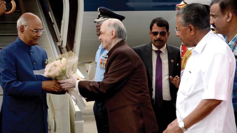 Governor P. Sathasivam receives President Ram Nath Kovind at the  Thiruvananthapuram airport on Sunday. Chief Minister Pinarayi Vijay looks on. (Photo: Peethambaran Payyeri)