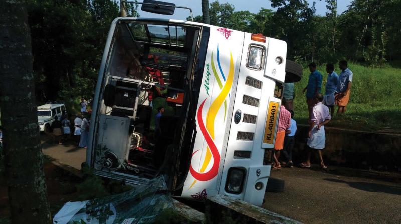 The school bus which turned turtle at Vengoor near Perumbavoor on Tuesday. (Photo: DC)