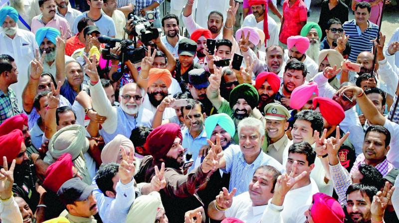 Punjab Congress president Sunil Jakhar celebrates with state cabinet minister Navjot Singh Sidhu and other party leaders after winning the Gurdaspur parliamentary bypoll, in Gurdaspur on Sunday. (Photo: PTI)