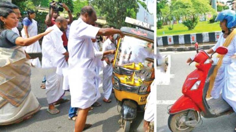 Bindu Krishna, along with others, block an autorickshaw in Kollam during hartal on Monday. She is seen later riding pillion on a motorcycle in Chinnakkada.	(Photo: DC)