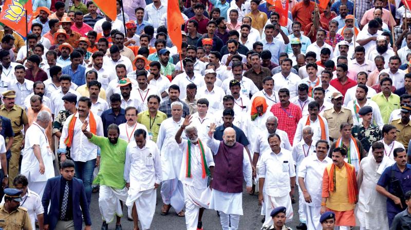 BJP president Amit Shah leads last leg of Janaraksha Yatra along with State president Kummanam Rajasekharan and party cadre at its finale in Thiruvananthapuram on Tuesday. (Photo: DC)